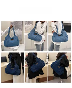 Detail view of denim tote bag on model showing large capacity and side pocket texture