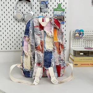 Mini backpack with colorful gradient fringe and patchwork denim design for women