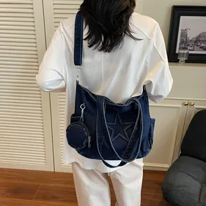 Large dark blue denim tote bag with star detail and mini pouch for women