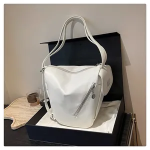 Detailed view of the white fashion shoulder bag presented in a premium gift box