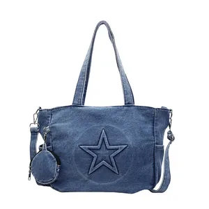 Denim tote bag with embossed star pattern and matching round coin purse in washed blue