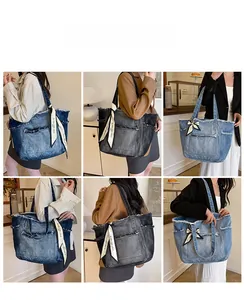 Détail de cabas en denim délavé contrasté avec bords frangés et ruban de soie déco