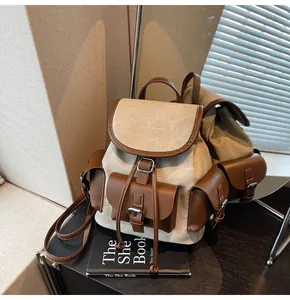 Detailed mirror view of retro canvas and leather backpack with large capacity