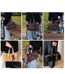 Close-up of vintage frosted leather tote bag with stylish strap and metal clasp detail