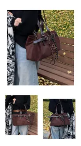 Close-up of vintage brown suede tote bag with leather straps and silver metal buckles