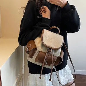 Retro canvas and leather backpack for women with vintage buckle pockets and large capacity