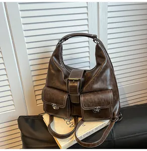 Detail view of vintage dark brown faux leather bag with stitching and double front pockets