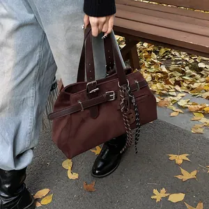 Retro dark brown suede tote bag with adjustable silver buckle straps for autumn style