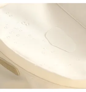 Close-up of waterproof Oxford fabric showing water droplets on beige backpack surface