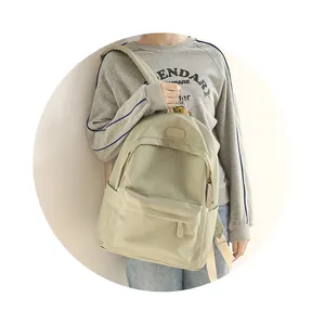 Detail of waterproof Oxford backpack showing premium nylon texture and spacious front pocket