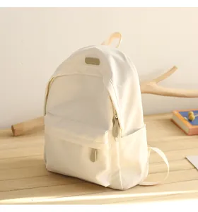 Detail of waterproof Oxford backpack showing the front pocket and side storage pocket