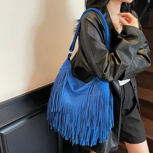 Bright blue suede-style fringe hobo shoulder bag with long tassels and wide strap
