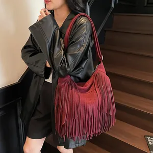 Bohemian dark red faux suede crossbody bag with long tassels and wide shoulder strap