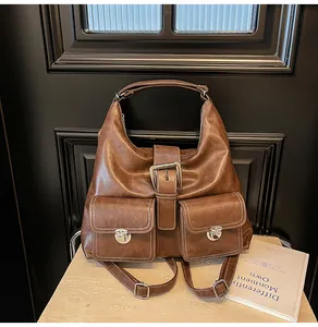 Detail of vintage coffee brown multi-way backpack and tote bag with retro metal buckles