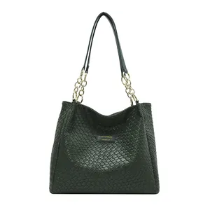 Dark green woven texture tote bag with gold chain strap and spacious commuter design