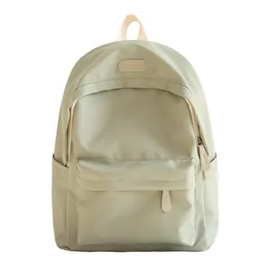 Minimalist waterproof oxford backpack in light sage green with spacious compartments