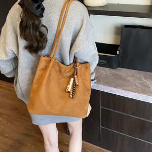 Retro suede hobo tote bag in camel with beaded tassel charm and double shoulder straps