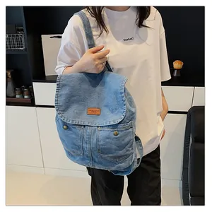 Vintage blue denim backpack with pockets and leather patch for women casual travel
