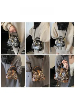 Detail view of leopard print shell bags in monochrome and brown styles with metal clasps