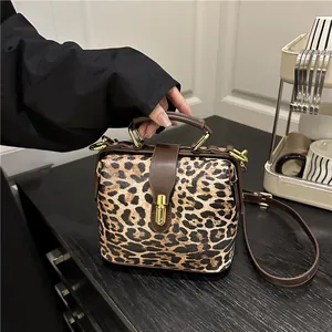Leopard print crossbody doctor bag with golden lock and adjustable strap for women