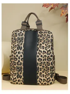 Detail of leopard print backpack with central black trim and side utility pockets