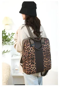Detail view of the leopard print nylon backpack with contrast panel and durable straps