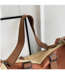 Detail of adjustable woven shoulder strap with silver buckle on canvas tote bag