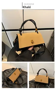 Detail view of khaki patchwork shoulder bag with retro gold lock and knotted handle
