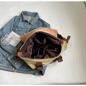 Interior view showing large capacity compartments and pockets of this canvas tote bag