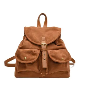 Vintage brown faux suede backpack with classic buckle closure and dual front pockets