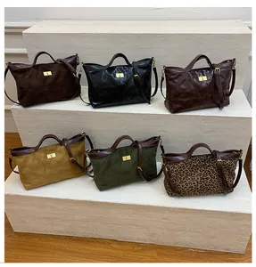 Detail view of six stylish underarm bags in various textures including matte and leopard print