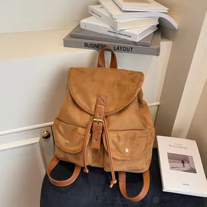 Sac à dos rétro en similicuir marron avec cordon de serrage et boucles métalliques élégantes