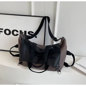 Detailed macro view showing the high-quality canvas and faux leather textures of this tote bag