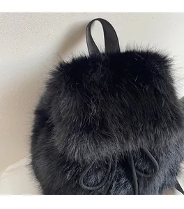 Close-up of soft black faux fur texture and nylon handle details on this stylish backpack