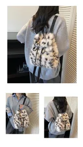 Detail of plush leopard print faux fur backpack with drawstring closure and slim straps