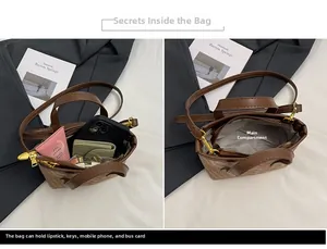 Detail view of the brown small bucket bag interior capacity and daily essentials storage