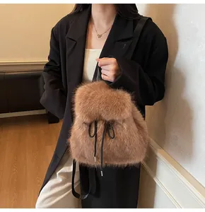 Detail of soft brown plush faux fur backpack with black nylon straps and fluffy texture