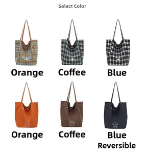 Three colors of double-sided tote bags featuring plaid pattern and dog embroidery detail