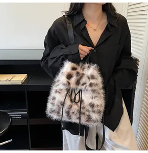 Close-up of leopard print faux fur backpack with black drawstring straps and fluffy texture