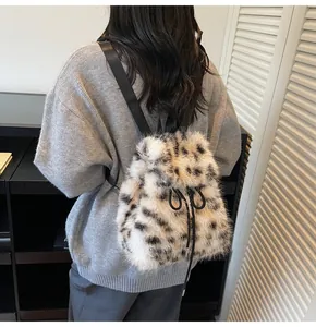 Detail view of leopard print plush backpack with soft faux fur and black drawstring