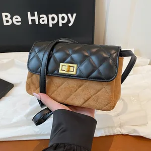 Chic quilted crossbody bag in black leather and brown suede with golden twist lock