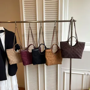 Quilted tote bags set with metal chain straps and circular handles in five chic colors