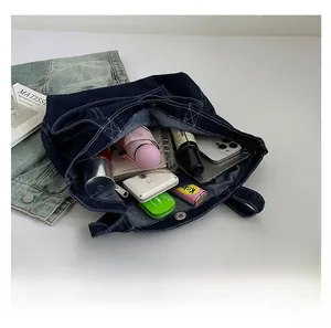 Top view of large capacity denim tote bag showing interior space with daily essentials