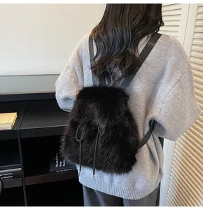 Detailed view of plush faux fur texture on black backpack with slim shoulder straps
