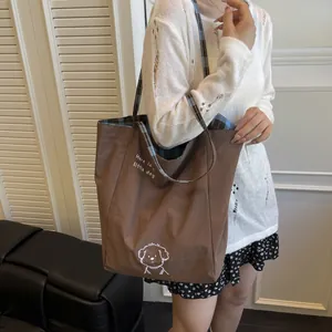 Brown large capacity tote bag with little dog print and plaid lining for daily commute