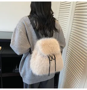 Detail of plush faux fur backpack showing fluffy texture and adjustable black straps