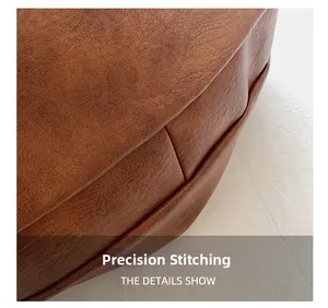 Detail of high-quality brown leather tote bag with precision stitching and premium texture