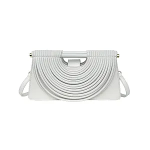 Chic white woven handbag with layered wave design and adjustable crossbody strap