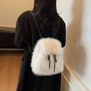 Plush white faux fur backpack for women featuring a drawstring closure and black straps