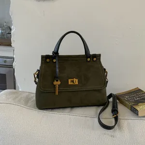 Retro suede Kelly bag in olive green with black leather trim and gold metal lock